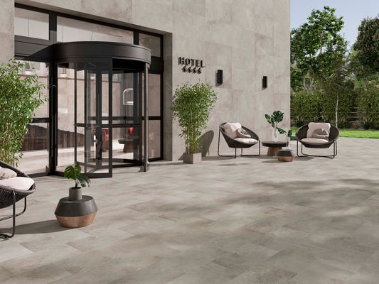 Ambiente con porcelánico Amstel Cemento efecto cemento gris 100x100